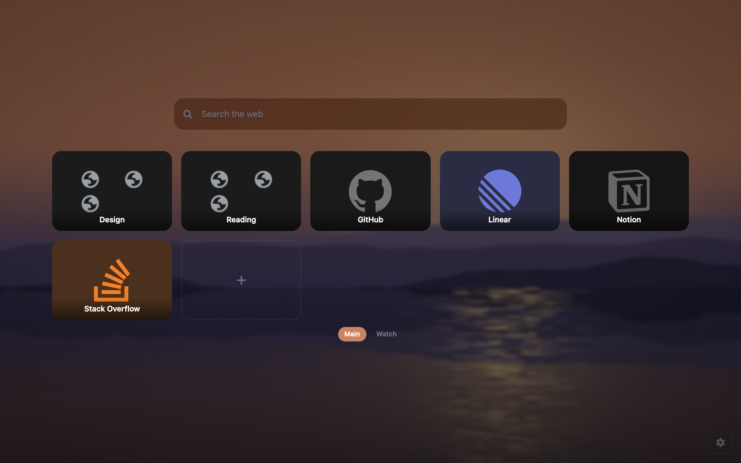 A tile grid over a dusk wallpaper with two folders named Design and Reading beside four ordinary tiles, and a page switcher underneath offering Main and Watch.